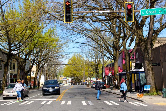 Pedestrians using the crosswalk to cross S Orcas Street