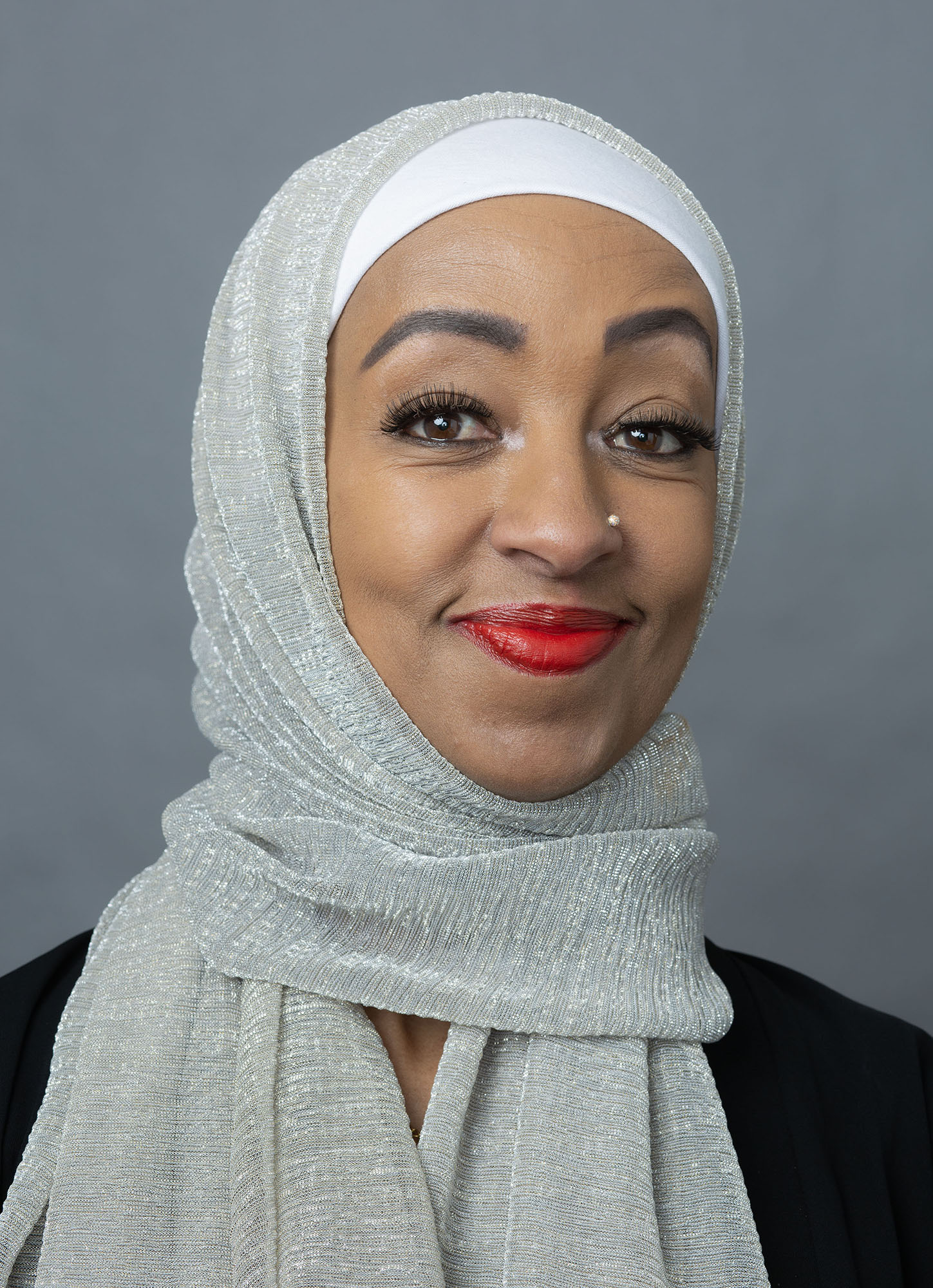 woman in hijab wearing sweater