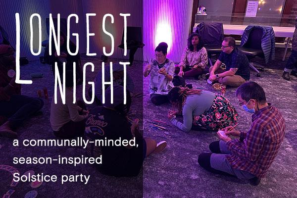 People sit in a circle making art and talking. 