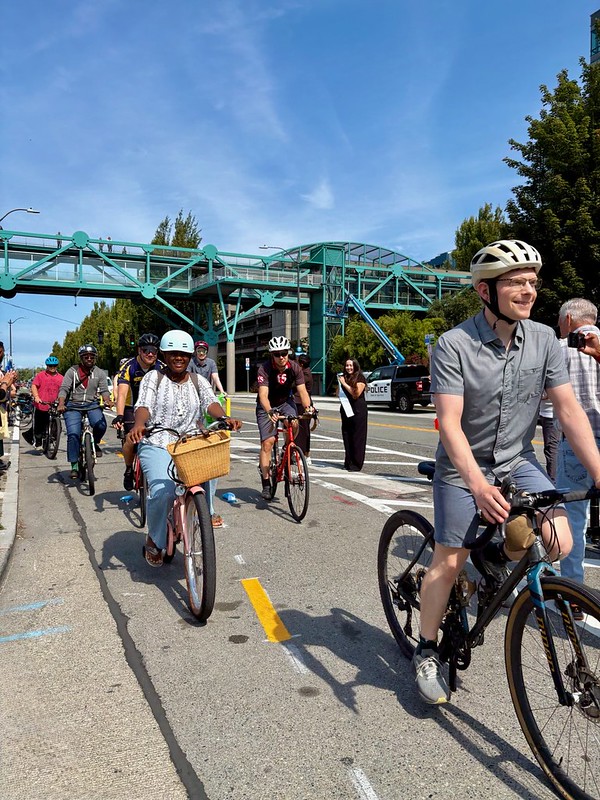 Bicyclists riding on the new protected bike lanes on Alaskan Way.