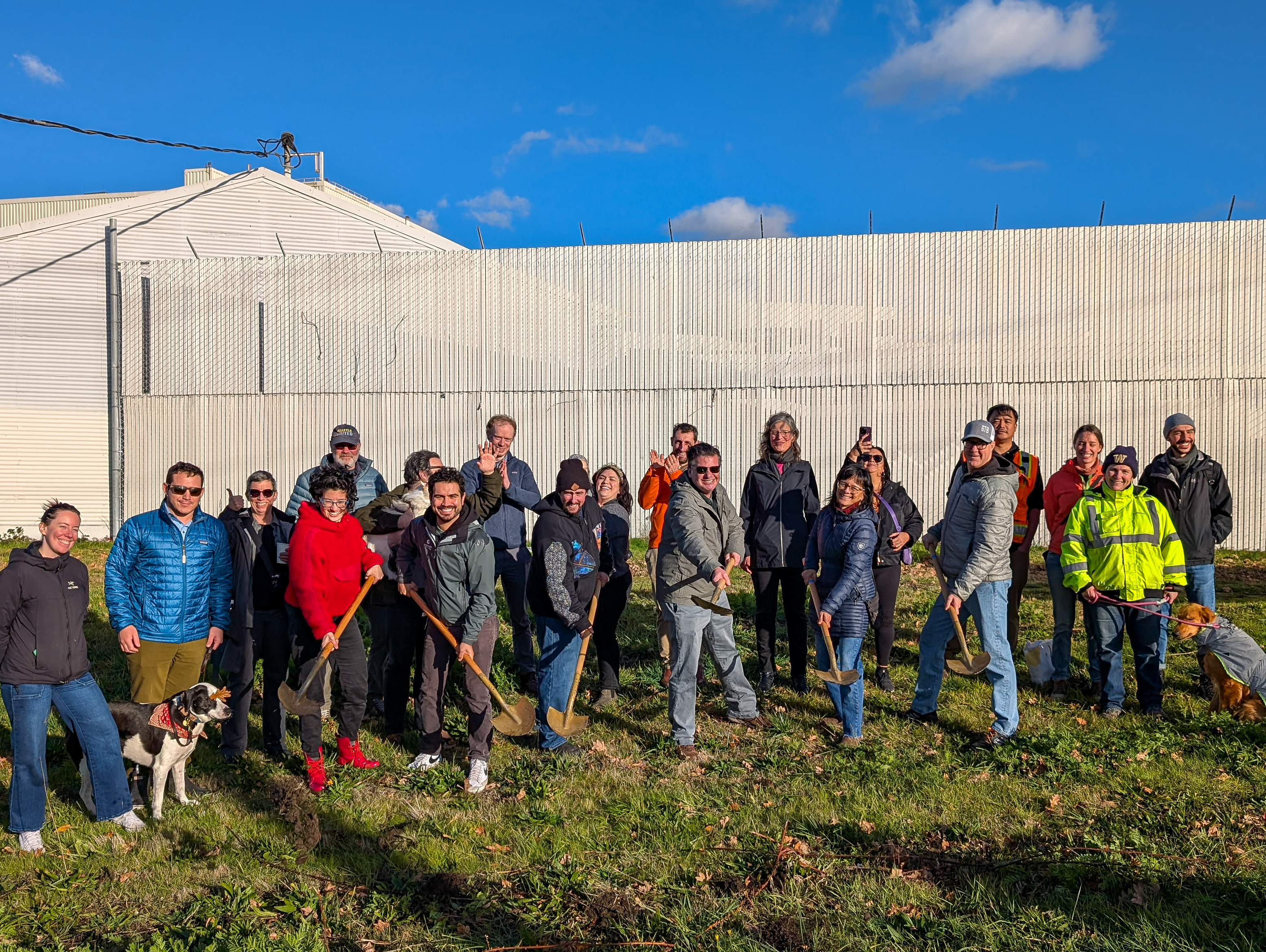 Photo of staff, partners, and community members celebrating project groundbreaking.