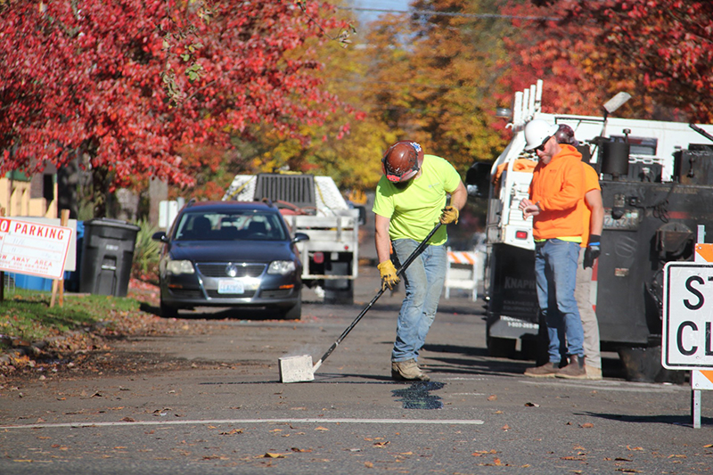 Workers performing pavement repairs