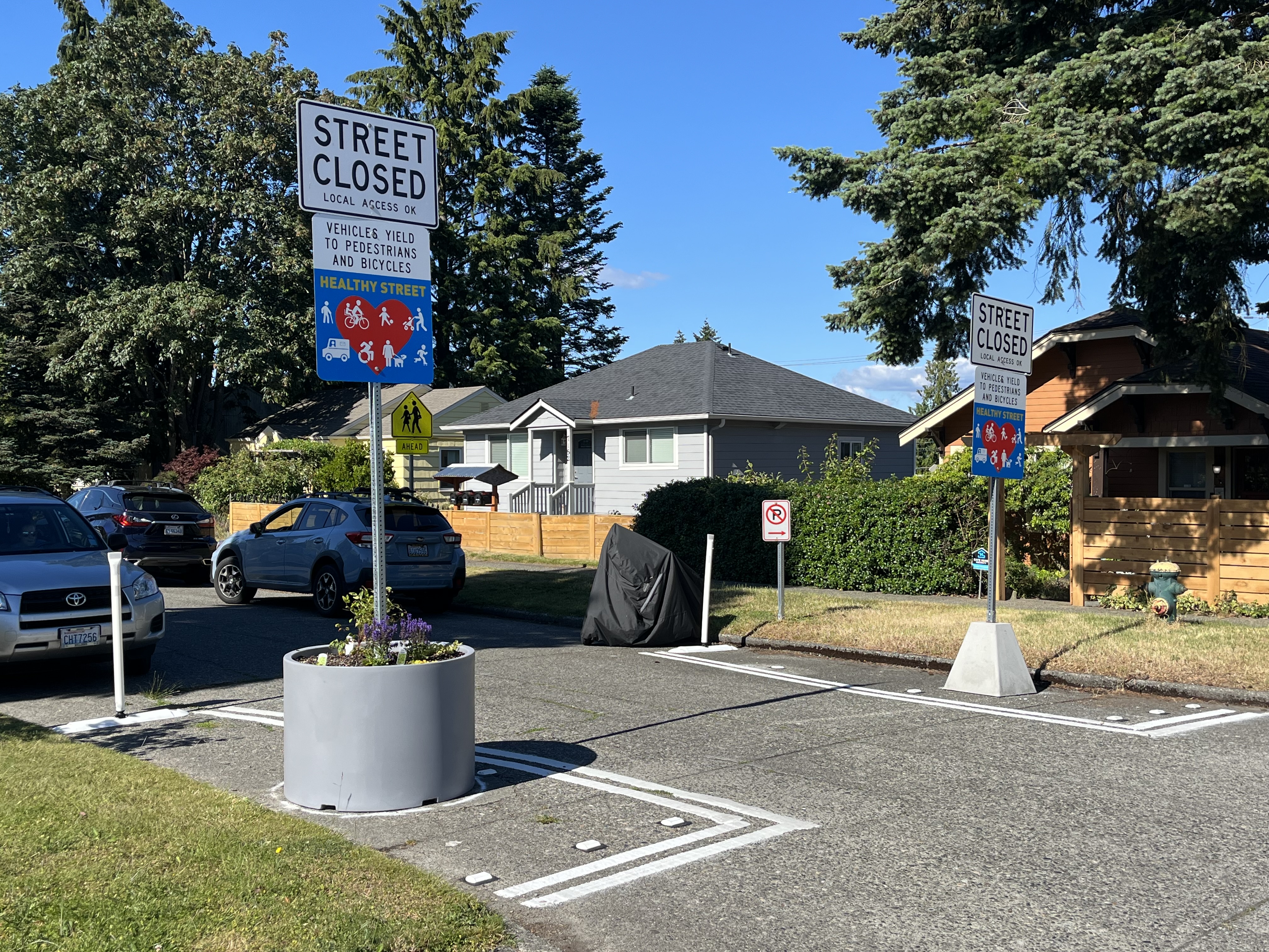 Permanent Healthy Street Sign base and a Planter sign base with flowers growing