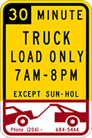 Sign that says 30 Minute Truck Load Only and dates and times and a car being towed
