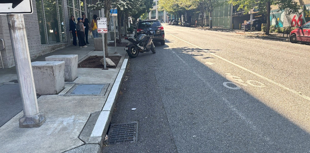 Bike lane with barely visible paint lines and no separating from the road. 
