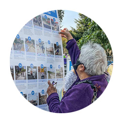 A community member choosing transportation options at an outreach event