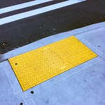 Curb Ramp with yellow panel and bumpy texture