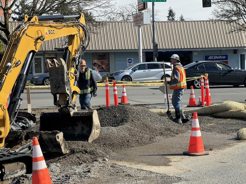 Crews preparing to lay gravel before repaving the east side of 30th Ave NE.