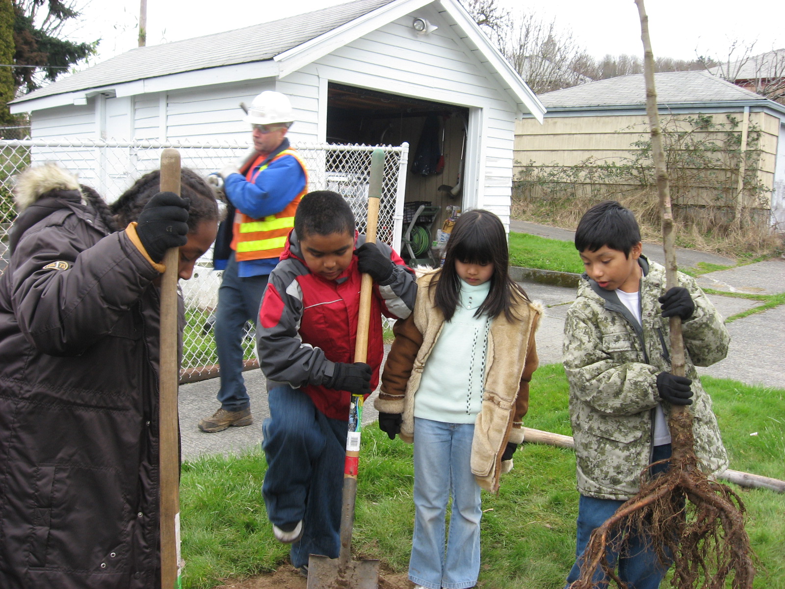 Kids planting a tree