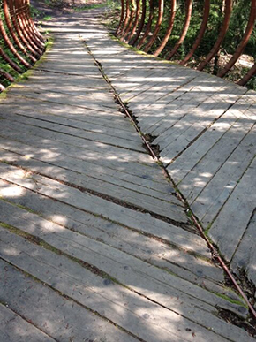 The previous weathered wooden decking.