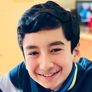 Headshot of Max smiling.