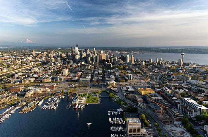 Aerial view of the Seattle skyline looking south, with the skyline and Mount Rainier in the background.