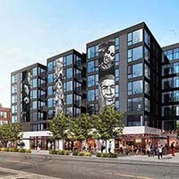 A 3-dimensional rendering of the exterior ofthe building from the street. The building is a dark color with large murals of people's faces on the outside of the building. Pedestrians are walking around the ground level. Trees line the sidewalk. The description of the image: Lifting up undervalued or disenfranchised voices connect the dots between developer and community leaders to create a design that reflects the community being served.