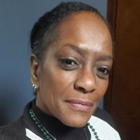 Renee has short hair with a sprinkling of gray.