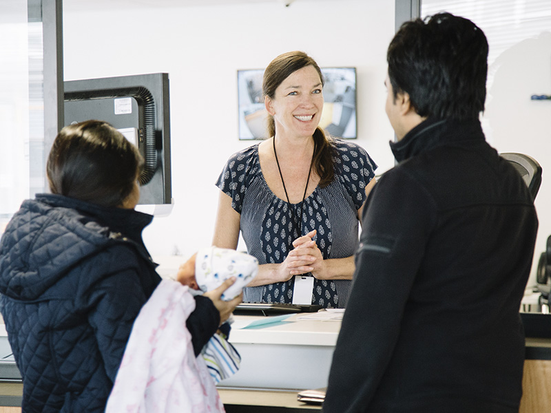 Staff member helping customers at the Central Customer Service Center