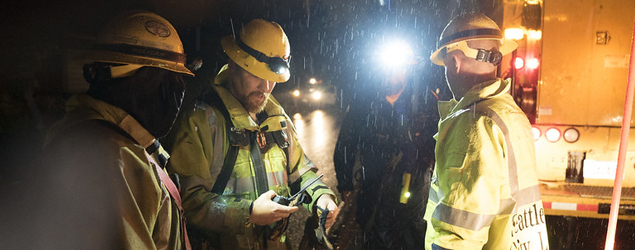 A group of City Light crew members at work in the rain