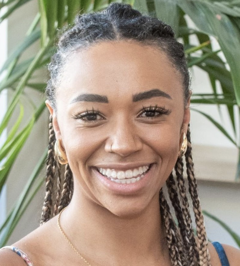 Headshot of Emily Pinckney from the shoulders up smiling.  
