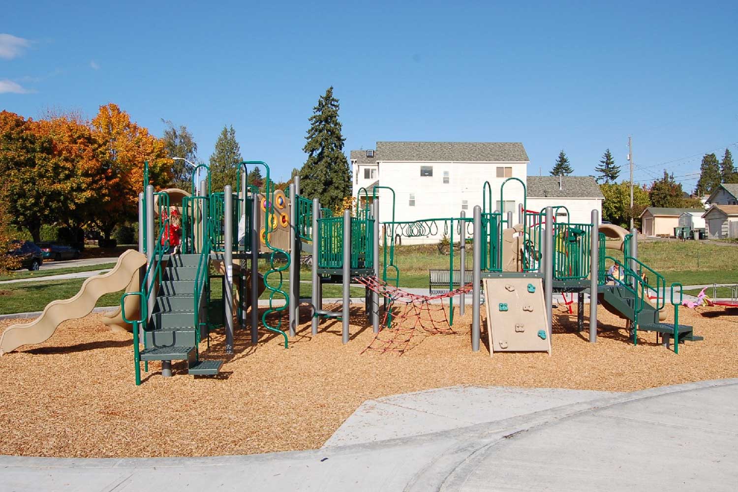 Ercolini Park playground and sidewalk - photo by Laurel Mercury