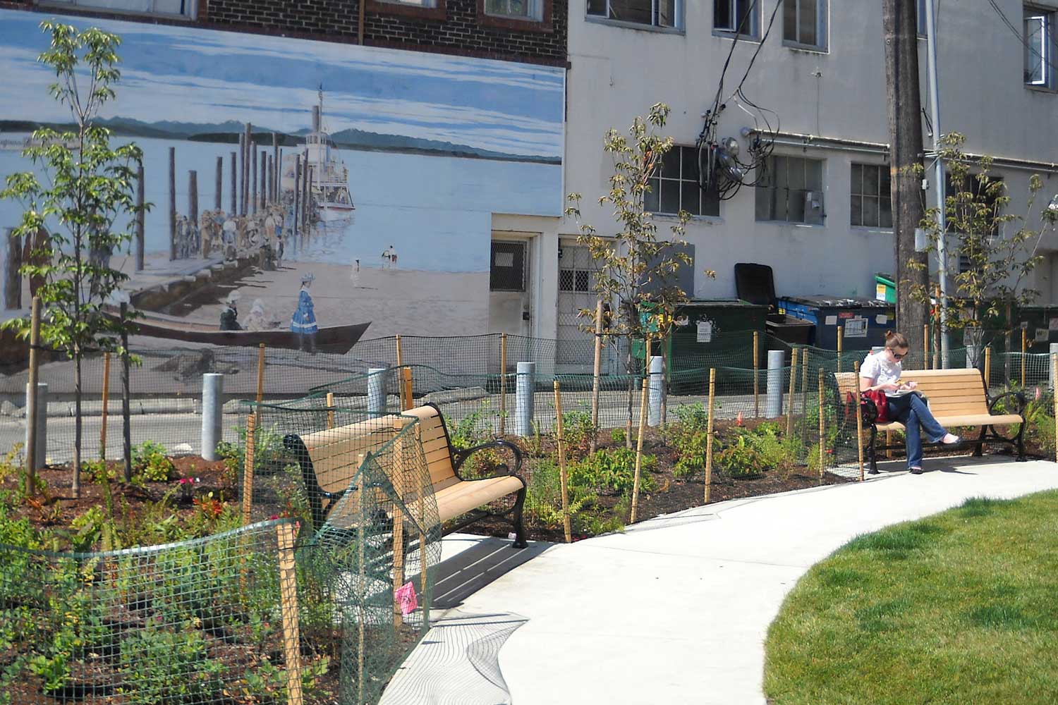 Junction Plaza benches on path - photo by Laurel Mercury