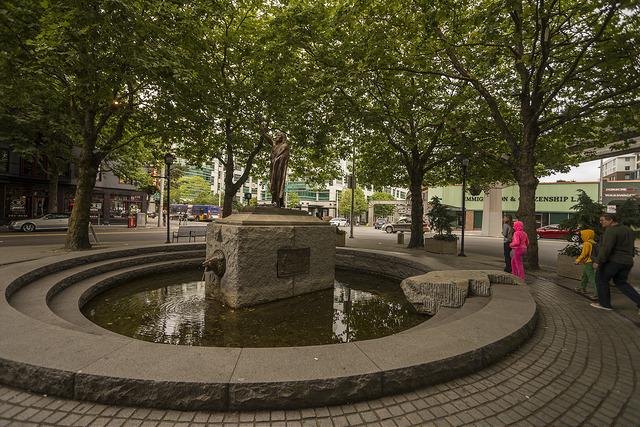 Tilikum Place plaze with pedestrians