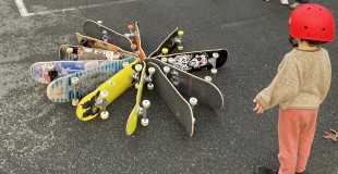 A child looking at skateboards at a Rec 'N The Streets outdoor activation