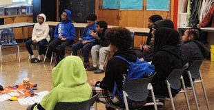 Students watch a presentation at a Community Learning Center