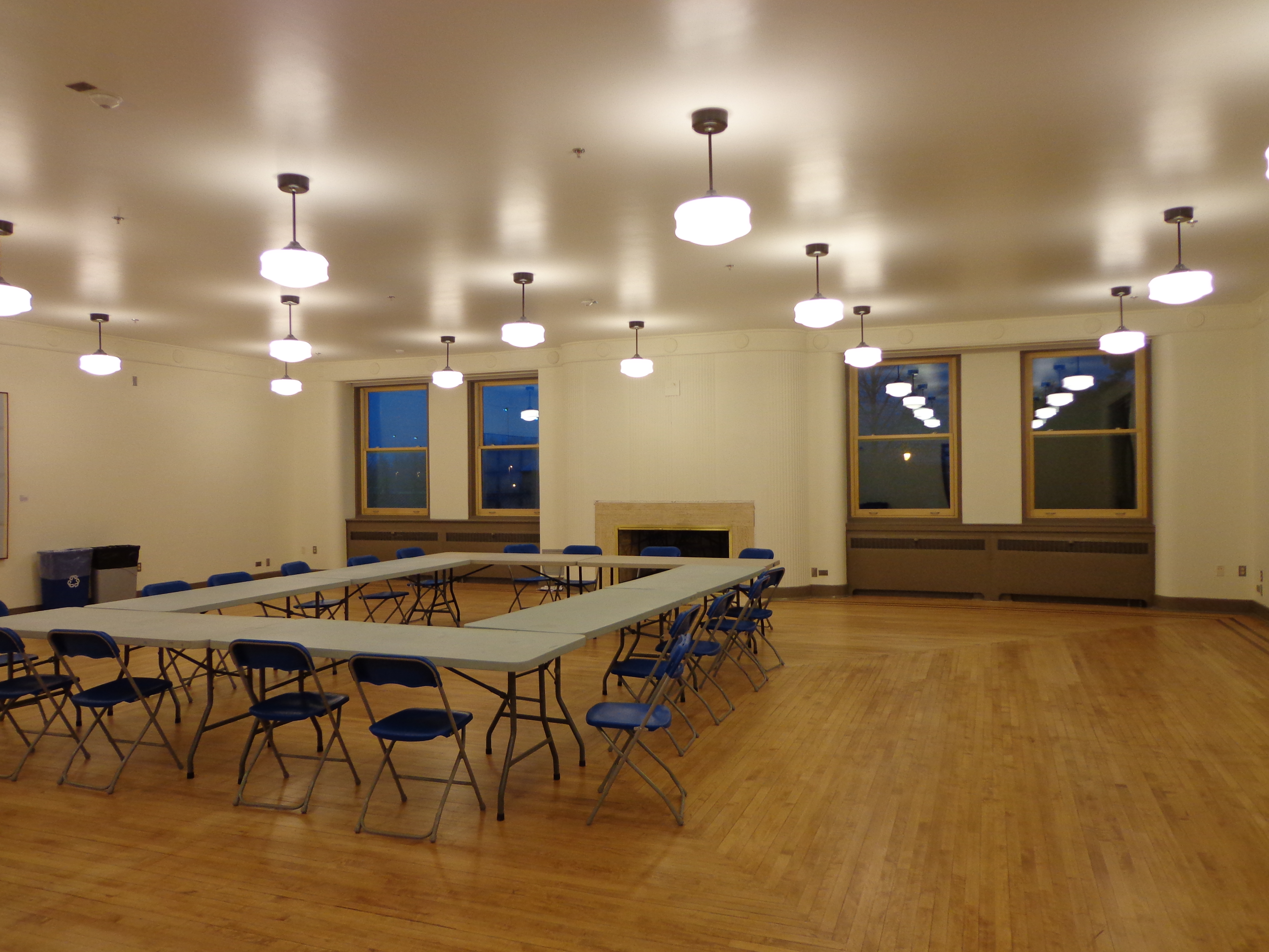 Magnuson Officers Club set up in meeting format with tables and chairs
