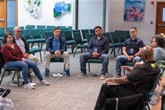 Group of people sitting in a circle