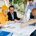 Community members reviewing planning documents