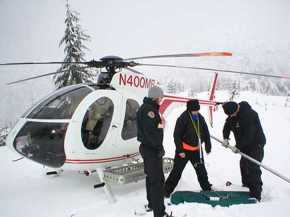 Watershed inspectors work together to perform a snow survey in the Upper Rex River basin. Their work supports the data collected from the Rex River Weather Station and Snotel site operated by the U.S. Department of Agriculture (USDA) National Water and Climate Center.