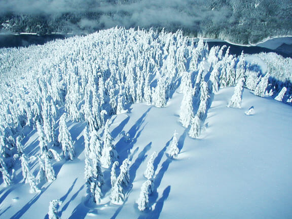 Deep snow blankets the upper mountains near Chester Morse Lake in the Upper Cedar River Watershed.