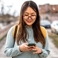 High school girl looking at her phone