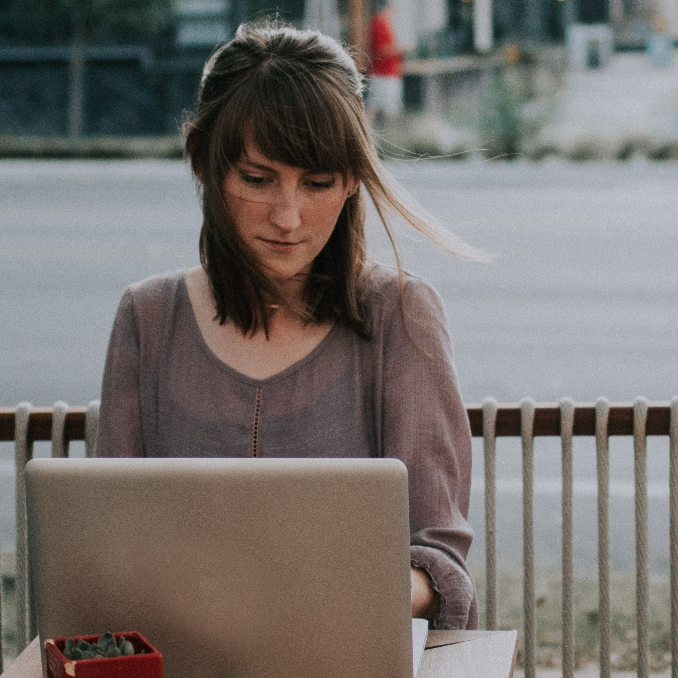 Woman using laptop in public