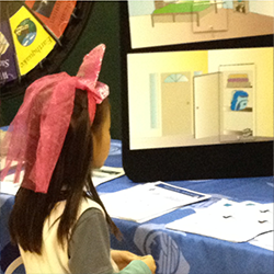 Child looking at emergency preparedness document handouts